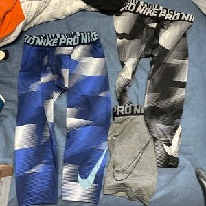 Lot of Men’s Nike compression shorts. Size small in blue, black, and grey.
